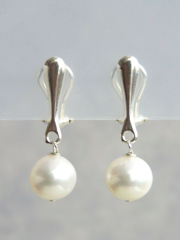 Handmade earrings with a choice of sterling silver,  gold vermeil or rose gold vermeil clip on fastenings A simple stunning pair of clip on earrings with a 9-10mm near round freshwater pearl with very good shiny lustre.  The overall length of the earrings are approximately 3cm. The pearls are freshwater pearls therefore each one is slightly different in shape and sizes and has its own unique markings and blemishes.   Gold vermeil and Rose gold vermeil is genuine 925 sterling silver that has been Classic White Gold Clip-on Earrings For Anniversary, Sterling Silver White Gold Clip-on Earrings, Gold Clip-on Sterling Silver Jewelry, Classic Sterling Silver Drop Clip-on Earrings, Classic White Gold Clip-on Earrings, Elegant Silver Clip-on Earrings With Pearl Drop, Elegant White Gold Sterling Silver Clip-on Earrings, Classic Sterling Silver Clip-on Earrings, White Gold Clip-on Pearl Earrings Fine Jewelry