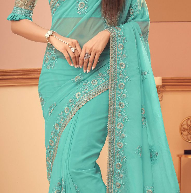 Aquamarine Blue Designer Embroidered Silk Wedding Saree-Saira's Boutique Blue Formal Traditional Wear With Floral Embroidery, Formal Blue Traditional Wear With Floral Embroidery, Blue Embellished Saree For Eid, Blue Traditional Wear With Intricate Embroidery For Formal Occasions, Elegant Blue Embellished Traditional Wear, Fitted Blue Embellished Traditional Wear, Fitted Embellished Blue Traditional Wear, Formal Georgette Saree With Intricate Embroidery, Light Blue Embroidered Wedding Sets