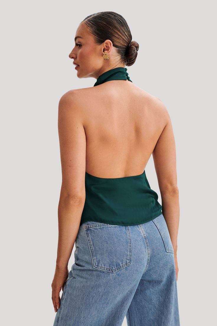 Elevate your everyday.Introducing the SERAPHINE Satin Halter Top, a vision of elegance and allure. Crafted to perfection, this top features a stunning halter neckline adorned with a graceful cowl detail, adding a touch of sophistication to your look. The low back design exudes understated glamour, while the asymmetrical hemline adds a modern twist. Complete with a delicate button closure at the neckline, it ensures a secure and stylish fit. Lined for comfort and coverage, this top promises a lux Capsule Wardrobe Basics, Understated Glamour, Maxi Dress Sale, Black Tie Wedding, Beige Dresses, The Low, Swimwear Sale, Halter Neckline, Back Design