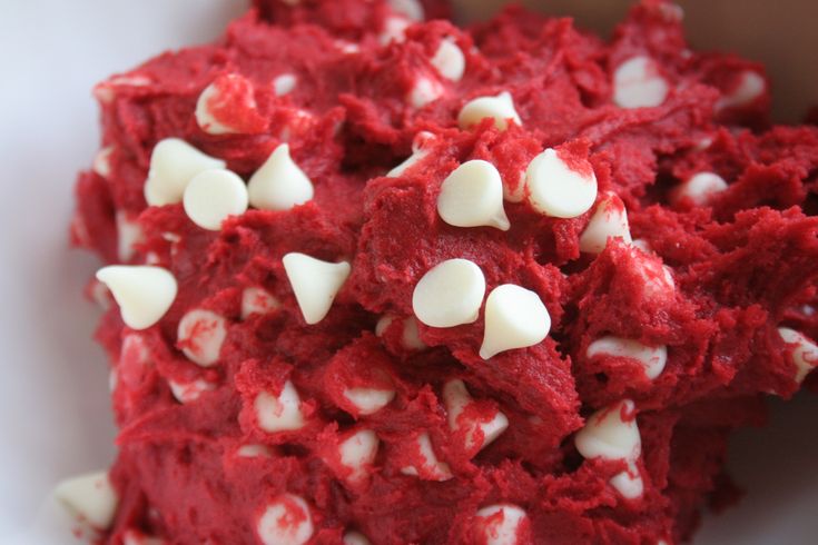 red velvet dessert with white candy hearts in it's center and on the side