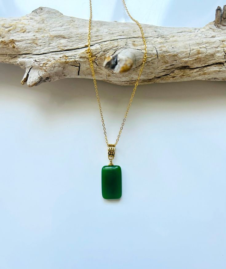 A piece of charming & elegant dark square green jade pendant necklace, which is made with genuine 100% natural real green jade cube and 18k gold plated necklace. A great combination of modernness and vintage styles. The simple and minimalistic gold color design adds a spark to your daily wear or a bit of charm for your date night. Perfect as a gift for your loved ones or just treat yourself. Some Highlights of this dark green genuine jade circle pendant are: ＊High-quality Material Only Made from quality Chinese green square jade paired with solid 925 sterling silver, plated with 18k gold. Ensures long-lasting and is great for sensitive skin. ＊Simple & Elegant Design A simple and classy jade cube pendant makes great decor for all sorts of occasions. subtle but eye-catching. ＊Measurements: T Elegant Green Emerald Necklace With Rectangular Pendant, Elegant Green Rectangular Emerald Necklace, Elegant Green Jewelry With Rectangular Pendant, Elegant Green Necklace With Rectangular Pendant, Elegant Green Rectangular Pendant Necklace, Elegant Green Rectangular Necklaces, Elegant Green Rectangular Necklace, Elegant Dark Green Jade Jewelry, Green Rectangular Emerald Jewelry