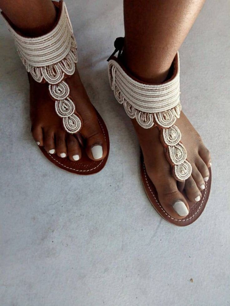 Long lasting quality guarantee High quality materials Superior fit  Best for outdoor trips Perfect for weddings, parties and African themed events For perfect fitting kindly use the last image as a guide 100% handcrafted using soft leather and fine beads All sizes are available We ship via DHL express For wholesale please contact us Bohemian T-strap Sandals For Summer, Bohemian T-strap Sandals With Ankle Strap, Adjustable Closed Toe Barefoot Sandals For Summer, Bohemian T-strap Toe Post Sandals For Summer, Bohemian T-strap Sandals With Round Toe For Summer, Bohemian Toe Post T-strap Sandals For Summer, Closed Toe Barefoot Sandals For Summer Beach, Elegant Handmade Beach Sandals, Summer Closed Toe Barefoot Sandals