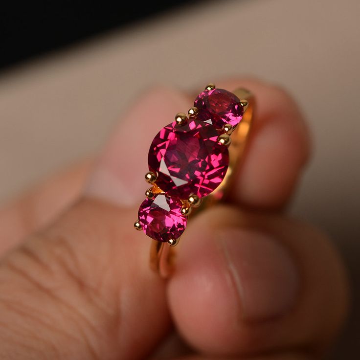 This is a gorgeous handmade creation. Its beauty is its simplicity & Elegance. The 8*8 mm round cut ruby(about 2.60 ct) is crafted in solid sterling silver or 14k white/rose/yellow gold All item is sent in a beautiful gift box If you have any idea of design your ring,pls contact me directly. You can realize more lovely stuff clicking the link https://www.etsy.com/shop/knightjewelry?refshopsection_shophome_leftnav Please leave the correct address and you phone number for delivering successful Fine Jewelry Ruby Round Cut, Fine Jewelry Round Ruby Ring, Red Brilliant Cut Pink Sapphire Jewelry, Lab-created Ruby Birthstone Ring, Formal Ruby Birthstone Ring, Red Pink Sapphire Jewelry With Brilliant Cut, Formal Ruby Cluster Ring, Red Solitaire Sapphire Ring, Red Round Solitaire Sapphire Ring