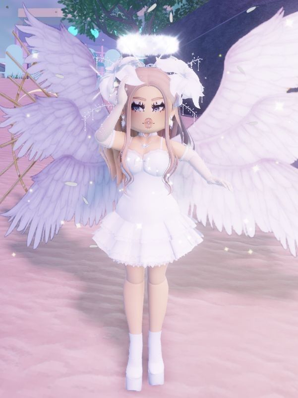 a girl in a white dress with angel wings