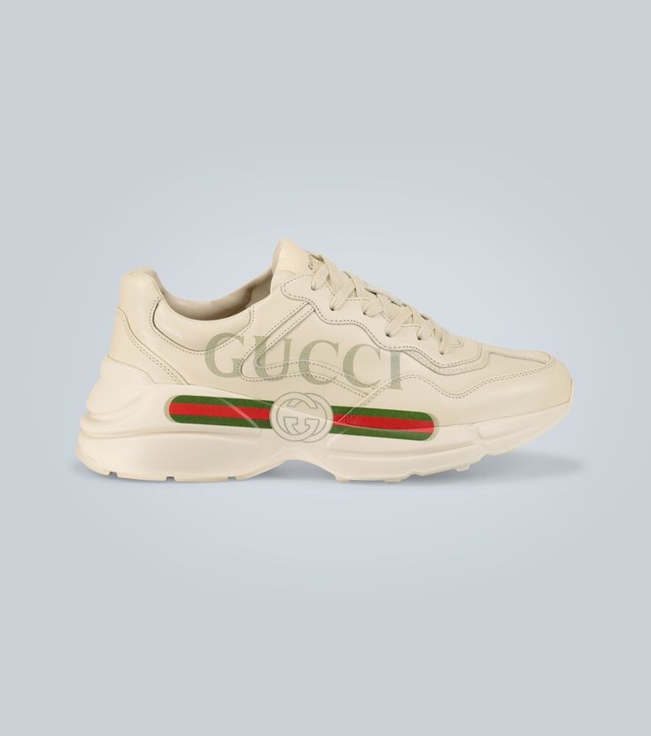 Set on chunky soles with paneled leather uppers, these Gucci sneakers feature a version of the label's logo from the 1980s printed across the sides. Sporty Platform Sneakers With Logo-print Tongue, White Platform Sneakers With Logo-print Tongue, High-top Leather Platform Sneakers With Logo-print Tongue, Luxury Leather Platform Sneakers With Logo Print, Luxury Leather Logo Print Platform Sneakers, Leather Platform Sneakers With Logo Print And White Sole, Leather Platform Sneakers With Logo Print, Gucci Sneakers With Embossed Logo And Round Toe, Sporty Gucci Sneakers With Embossed Logo