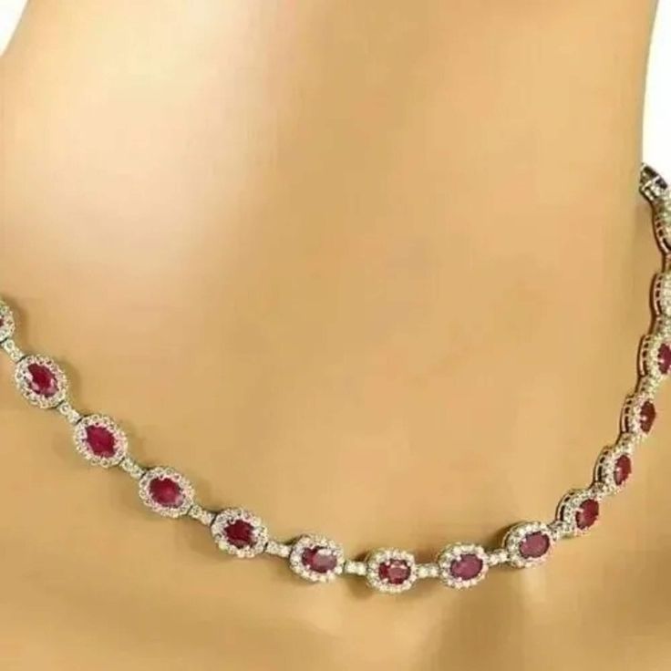 "22 Ct Oval Simulated Red Ruby Women's Tennis Necklace, 14K White Gold Plated, Halo Tennis Women's Necklaces ✤Details✤ Handmade item Ships from a small business in India Metal : Yellow Gold, Rose Gold, White/Silver Gold Finish Gemstone: Cubic Zirconia Gem color: Red Plating color: White  Style: Art Deco  Can be personalized Made to Order ✤Description✤ The most unique jewelry you can find, the perfect gift for you and your loved one.It Is Simulated Gemstone & Diamond And The Cut Of The Stone Is Excellent. The Product Is Available In All Types Of Gold Plated Such As White Gold Plated, Yellow Gold Plated, Rose Gold Plated. * Material : High Quality Solid 925 Sterling Silver * Metal Color: White/Yellow/Rose Gold and Made to Order. * Diamond type: Ruby * Diamond Color : Red  * Main Diamonds Cut Ruby Tennis Necklace, Red Oval Necklace For Formal Occasions, Red Oval Necklaces For Formal Occasions, Oval Ruby Jewelry With 17 Jewels, Oval Red Necklace For Anniversary, Red Oval Necklace For Anniversary, Red Oval Fine Jewelry, Fine Red Oval Jewelry, Red Oval Diamond Jewelry