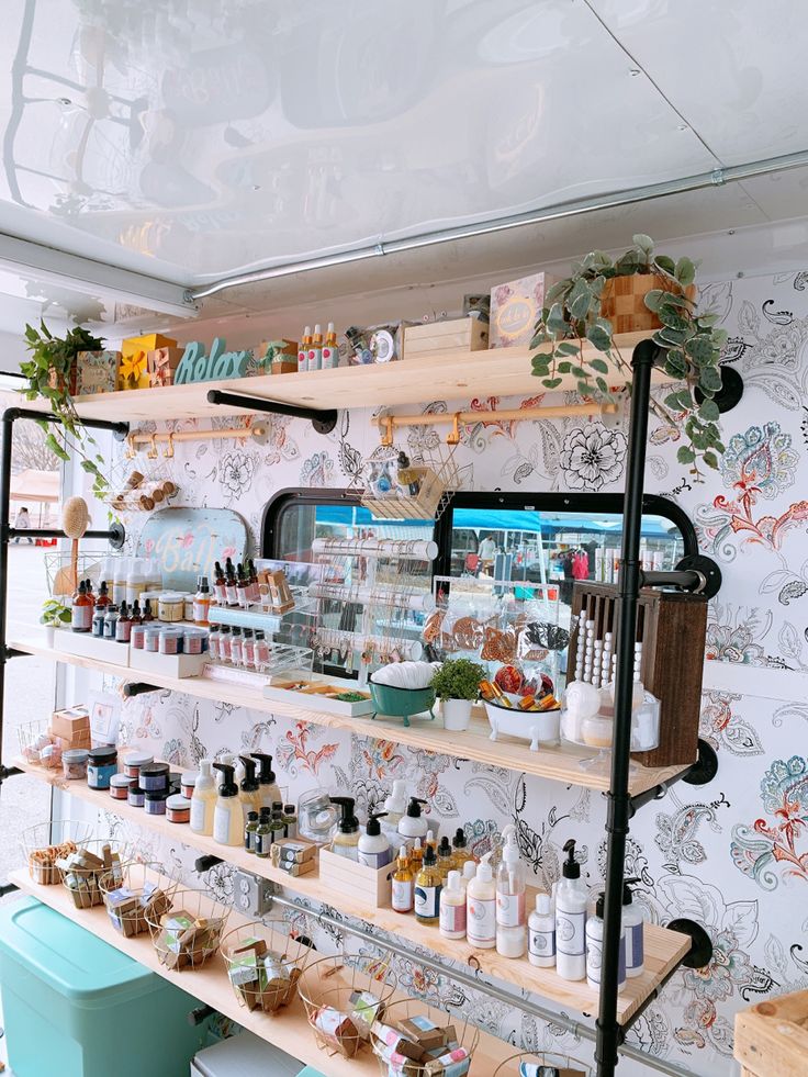 the shelves are filled with many different types of cosmetics and other things on display in front of them