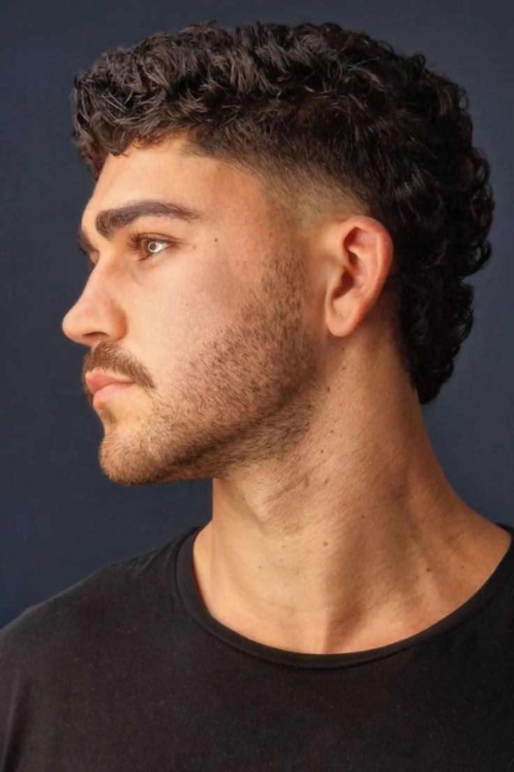 The Best 25 Modern Mullet Haircuts for Men (Detailed Gallery) | Heartafact Thick Mullet Men, Haircut For Man Curly Hair, Buzzcut Mullet Fade, Men’s Shaved Sides Haircut, Slightly Wavy Hair Men, Side Quiff Men Hairstyles, Men’s Modern Mullett, Modern Muller Men, Side Taper Mullet