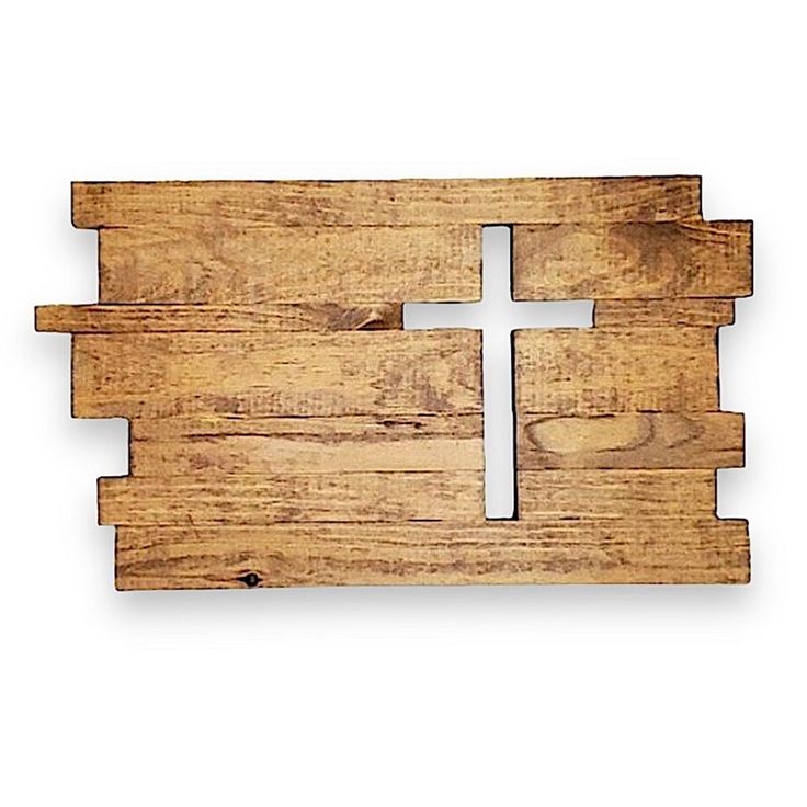 a wooden cutting board with a cross cut out on it's side and two pieces of wood in the middle