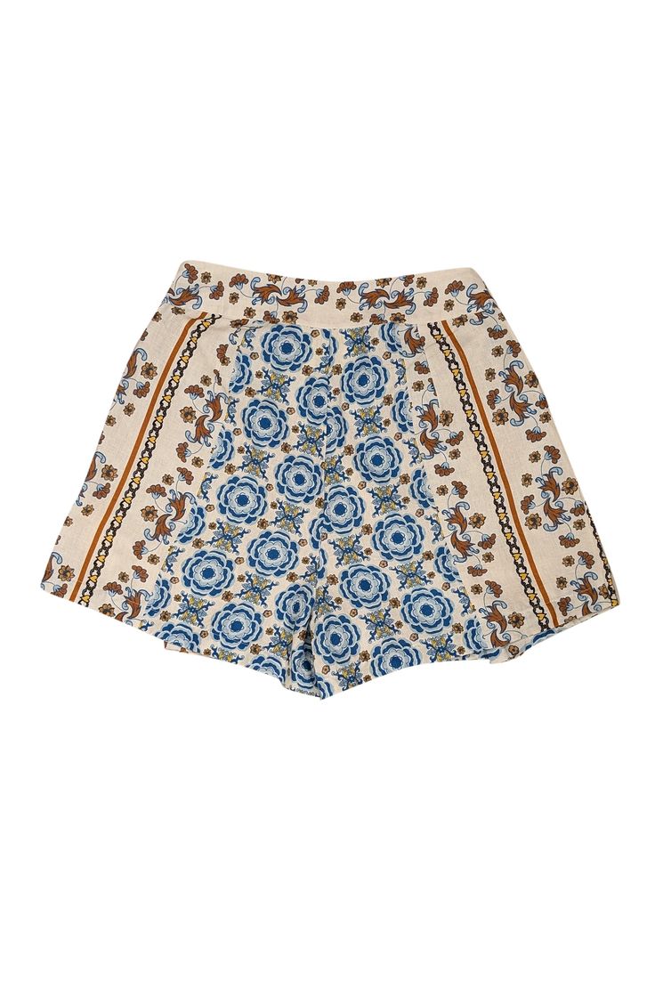 Revamp your wardrobe with these Carolina K boho shorts in a playful mix of cream, blue, yellow, and rust. Featuring a floral print and flattering pleats, they're the perfect weekend essential for your spring and summer style. Complete your vacation look with a pair of raffia sandals and get ready to turn heads! Size M 45% Cotton, 55% Hemp Pleated detail on sides Pockets on sides Invisible side zipper Waist 29" Hips 39" Inseam 3" Length 16" Raffia Sandals, Vacation Looks, Pleated Shorts, Boho Shorts, Summer Style, Side Zipper, Blue Yellow, Rust, Floral Print