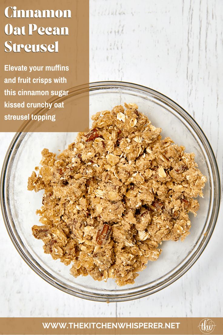 a bowl filled with granola on top of a white table