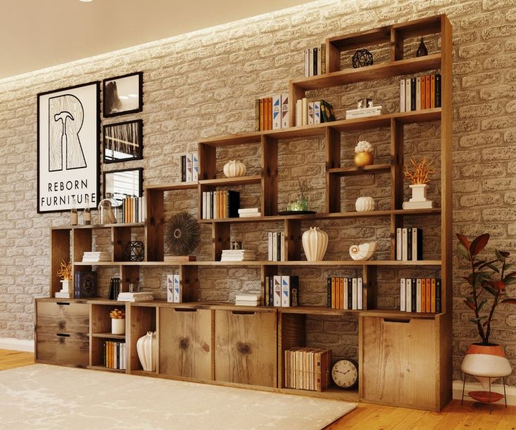 a living room filled with lots of books and furniture next to a wall mounted book shelf