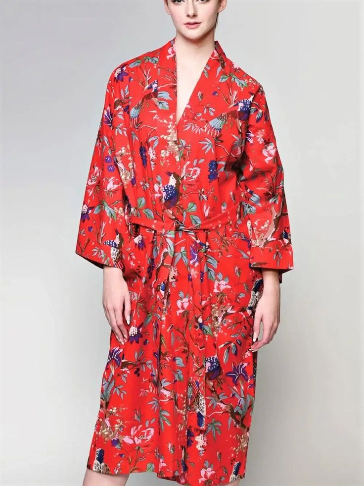 This luxurious long Red Kimono Robe features a gorgeous birds of paradise print on soft lightweight cotton. Handmade by artisans in Rajasthan, India, this truly exclusive red kimono robe features a front tie belt, long flowy sleeves and two large front pockets. Handcrafted with eco-friendly dyes, Fair trade and sustainably made, it's the perfect addition to your lounge-wear wardrobe. The lightweight woven 100% Cotton fabric also makes this a unique kimono bathrobe. This red kimono robe from Sevy Red Cotton Robe For Spring, Red Cotton Kimono For Vacation, Red Robe With Kimono Sleeves For Spring, Red Spring Vacation Robe, Red Cotton Long Sleeve Robe, Red Spring Robe For Loungewear, Red Long Sleeve Cotton Robe, Long Sleeve Red Cotton Robe, Red Cotton Robe With Kimono Sleeves