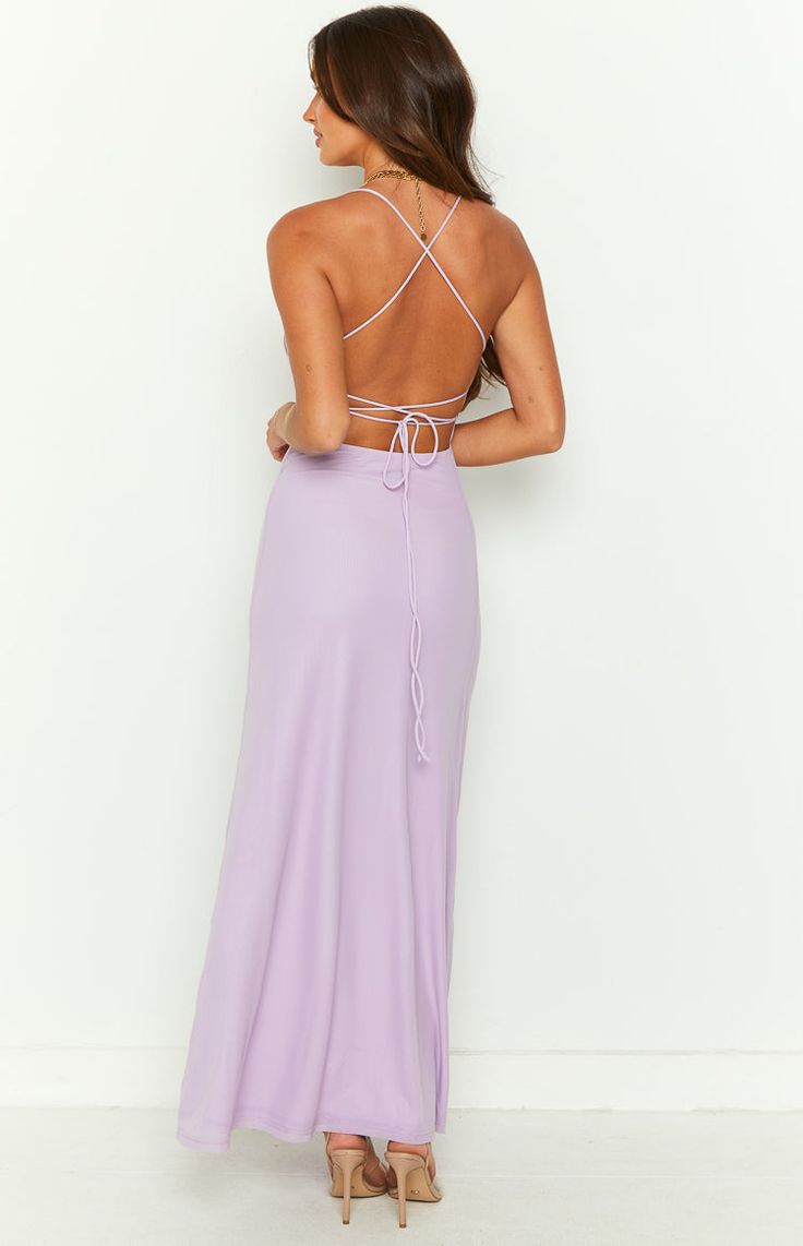 * Purple Mesh Maxi Dress 
 * Your next formal () event is sorted in this stunning lilac mesh maxi dress (). Obsessed with this tie up back style and mesh outer layer. Be sure to add heels () and dainty jewellery for a gorgeous look! 
 * 
 
 * Maxi length 
 * Mid weight material 
 * Lots of stretch 
 * Adjustable criss cross tie up back 
 * Lined 
 * Mesh outer layer 
 * Straight neckline Chic Spring Maxi Dress With Lace-up Back, Spring Formal Backless Maxi Dress, Spring Evening Maxi Dress With Tie Back, Chic Floor-length Maxi Dress With Lace-up Back, Purple Fitted Maxi Dress For Wedding Guest, Fitted Purple Maxi Dress For Wedding Guest, Bridesmaid Backless Maxi Dress With Lace-up Back, Maxi Length Prom Dress With Lace-up Back, Chic Strappy Back Maxi Dress For Prom