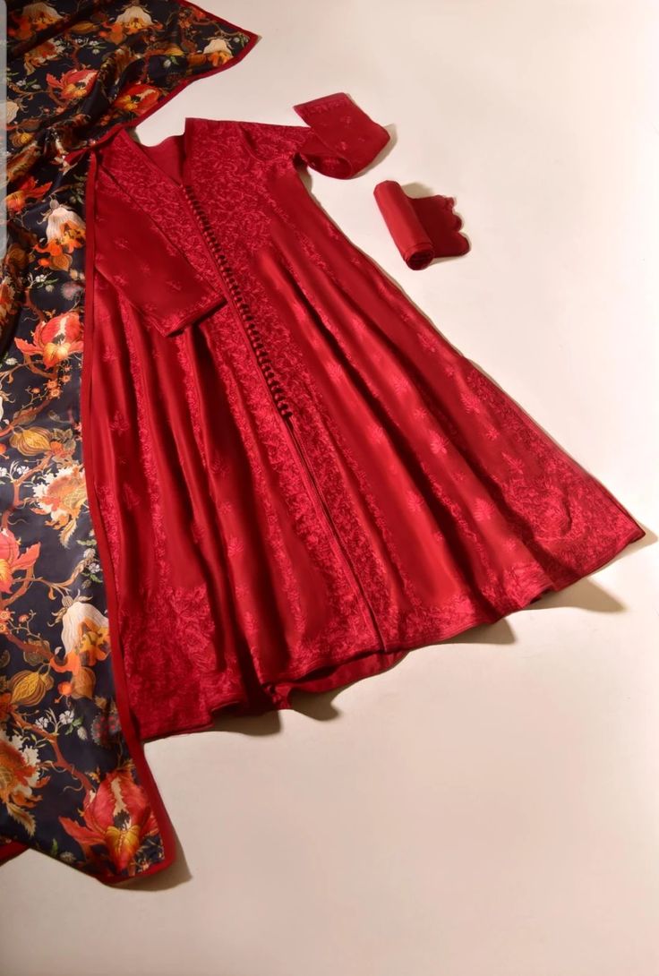 One of our most sought after looks, panelled frock with hand ari workmanship on a rich tone of crimson in pure cotton net. Paired with matching raw silk trousers and amazonian ( pure silk ) dupatta. This versatile look can be worn for luncheons or intimate gatherings.Agha Noor' style tip " Ari embroidery is always so v Red Raw Silk Anarkali Set For Navratri, Red Tussar Silk Designer Sets, Red Tussar Silk Designer Wear Sets, Red Cotton Silk Anarkali Set With Sheer Dupatta, Red Cotton Silk Bollywood Kurta, Red Bollywood Cotton Silk Kurta, Red Raw Silk Salwar Kameez With Sheer Dupatta, Red Raw Silk Traditional Wear With Sheer Dupatta, Festive Red Silk Anarkali Set