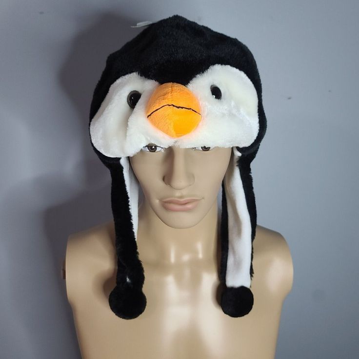 Penguin Fuzzy Stuffed Plush Animal Hat W/ Earmuff Protection Unisex Playful Adjustable Winter Costume Hats And Headpieces, Playful Winter Costume Hats And Headpieces, Black Beanie Costume Hat For Winter, Black Beanie For Winter - Costume Hat, Fun Winter Costume Cap, Black Cap For Winter Costume, Winter Novelty Adjustable Costume Hats, Novelty Winter Costume Hats And Headpieces, Fun Black Warm Hats