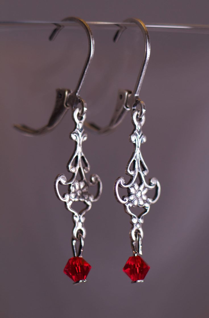 Victorian style earrings with 4 mm Swarovski Red crystals. The Earring are 1 1/2 inches long. Red Chandelier Earrings As Gift, Classic Pierced Chandelier Earrings As Gift, Classic Chandelier Earrings Gift, Classic Red Earrings For Party, Handmade Red Earrings For Formal Occasions, Red Chandelier Earrings For Formal Events, Elegant Handmade Red Crystal Earrings, Classic Red Party Earrings, Formal Red Chandelier Earrings