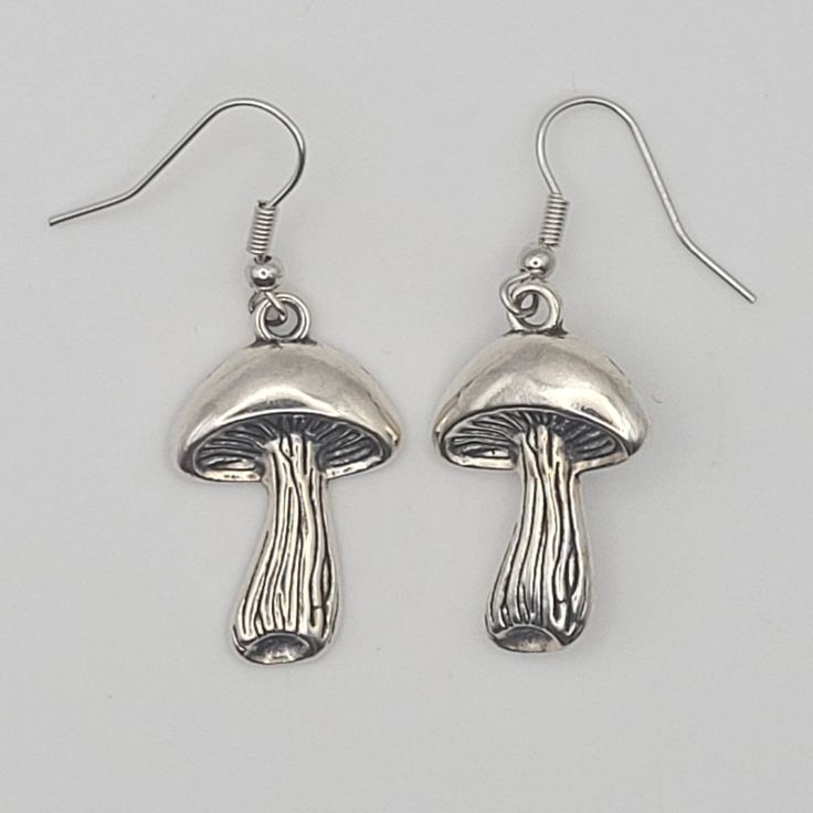 This listing is for your choice of a pair of Mushroom Earrings or the set of Mushroom Earrings with matching Ring! Ring is size 7! 🍄The mushroom is a symbol for kundalini energy and enlightenment. The stalk represents the spine and the little cap at the top of the stalk represents the opened crown chakra.  Mushrooms are also a symbol of good luck and good fortune! ✨️Free gift with every order!🎁 Mushroom Design Drop Earrings, Nickel-free Mushroom Shaped Earrings As Gift, Nickel-free Mushroom-shaped Earrings For Gifts, Adjustable Mushroom Design Drop Earrings, Metal Mushroom Design Jewelry As Gift, Earrings Mushroom, Kundalini Energy, Mushroom Ring, Mushroom Earrings