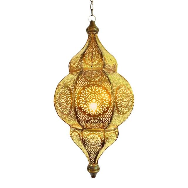 an intricately designed light fixture hanging from a chain on a white background with clippings