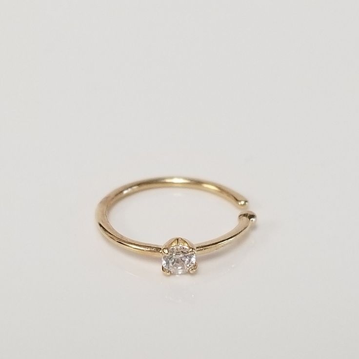 "Thanks for shopping our vintage estate store. We tend to sell well below wholesale and truly hope you enjoy all of our items. Many of the items are one of a kind, so please enjoy scrolling through the pictures and hopefully something will catch your eye. Brown spots are from camera or reflections. Nice estate 14k yellow gold .05ct CZ diamond nose ring. Size: 1/2\" 10mm Weight: .20 gram Ball tip: 1mm Post: 0.5mm CZ Diamond: .05ct Beautiful nose stud. Marked 14k." Beautiful Nose, Antique Rings Victorian, Diamond Nose Ring, Victorian Rings, Nose Ring Stud, Brown Spots, Nose Stud, Cz Diamond, Antique Rings