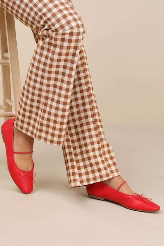 Let the compliments come because the Lulus Gilly Red Bow Ballet Flats will have everyone's attention the moment you step into the room! Smooth faux leather shapes these perfectly chic flats that feature a sleek slip-on silhouette with a square-toe upper, a dainty bow detail, and a slender elastic strap at the vamp. Pair with jeans and a white tee for an effortlessly trendy 'fit! 0. 25" rubber heel. Lightly cushioned insole. Rubber sole has nonskid markings. Man made materials. Imported. Lulus | Gilly Red Bow Ballet Flats | Size 6.5.