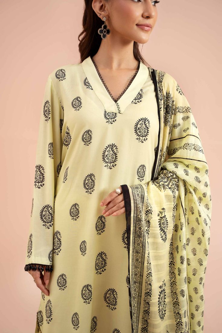 Brand: NishatCollection: Nishat Fall Fantasy Unstitched Summer CollectionFabric: Lawn Product Detail:Block Printed Style Shirt with Dupatta and Trousers SHIRTPrinted Lawn Shirt: 3 MeterFabric: LawnColor: Light Yellow DUPATTAPrinted Doriya Dupatta: 2.5 MeterFabric: DoriyaColor: Light Yellow TROUSERSSolid Cambric Trousers: 2.5 MeterFabric: CambricColor: Light Yellow DISCLAIMER:* Lining, Laces, and Tassels are not included in unstitched variants.* Embellishment items in stitched outfits are subject to market availability.* The actual colors of the outfit may vary from the colors being displayed on your device. CARE INSTRUCTIONS: Extra Fabric Has Been Used For Shoot Original Color May Vary Slightly From The Picture Dry Clean Recommended Iron The Clothes At Moderate Temperature Do Not Use Bleac Traditional Unstitched V-neck Sets, Traditional V-neck Sets With Printed Motifs, Unstitched V-neck Sets With Resham Embroidery, Eid Block Print Unstitched Sets, Unstitched V-neck Sets With Printed Motifs, Semi-stitched Block Print Long Sleeve Sets, Elegant Semi-stitched Lawn Suit With Printed Motifs, Unstitched Suit With Block Print For Wedding, Festive Block Print Lawn Suit For Wedding