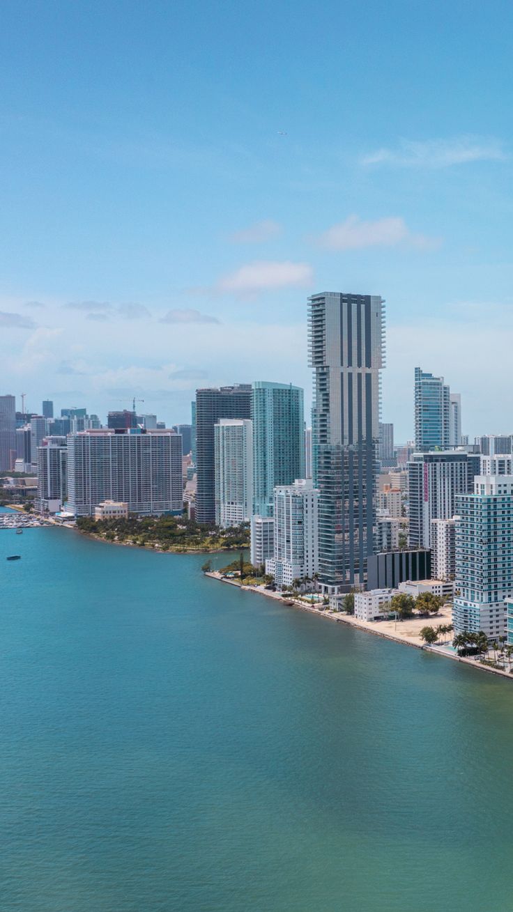 an aerial view of the city skyline and water