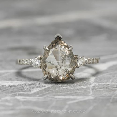 an engagement ring with two pear shaped diamonds