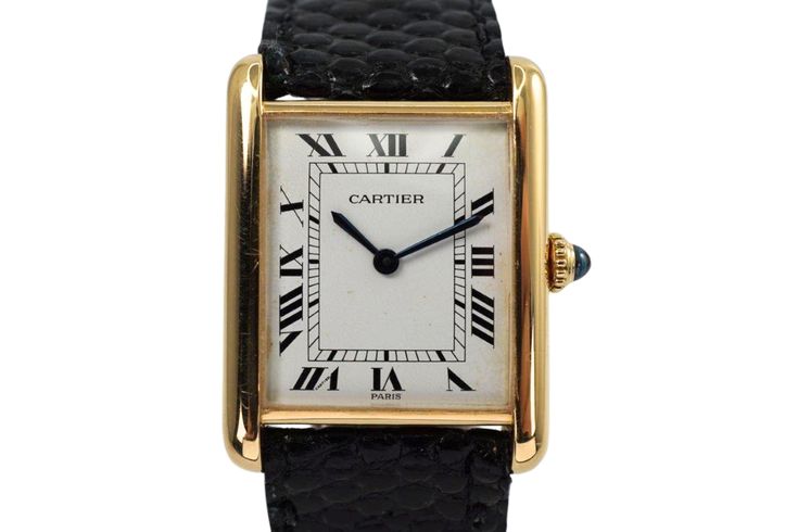 A nice vintage Cartier Tank Louis reference 78086 in 18k yellow gold, crafted during the 1980s. A popular and enduring classic from Cartier, featuring ivory dial, black Roman numeral markers and inner minute track, sword-shaped blued-steel hands and beaded blue cabochon crown encased by a 23.5mm rectangular case and slim 6mm silhouette. Paired with a black lizard strap and Cartier deployant buckle for a comfort fit, suitable for men or women.  Dial shows patina, crown has a nick on end, scratches on case. Original dial, hands and crown. Case measures 23.5 x 30mm, 6mm thick. Sapphire crystal.  Cartier cal. 2512-1(78-21) ETA, 17 jewels manual wind.  Case# 101xx New non-Cartier handmade black leather strap, fits 7 inches. 17mm lug width. Modeled on 6 inch wrist. This Cartier Tank has undergon Luxury Yellow Gold Collectible Watch, Classic Collectible Watch With Rectangular Dial, Classic Watches With Rectangular Dial For Collectors, Classic Yellow Gold Watch With Gold-tone Hardware, Classic Yellow Gold Watch, Classic Formal Watches With Gold Clasp, Luxury Formal Watches Stamped 14k, Luxury Formal Watches 14k Stamped, Luxury 14k Stamped Formal Watches