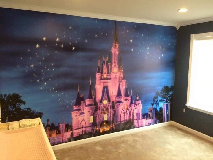 a room with a castle mural painted on the wall