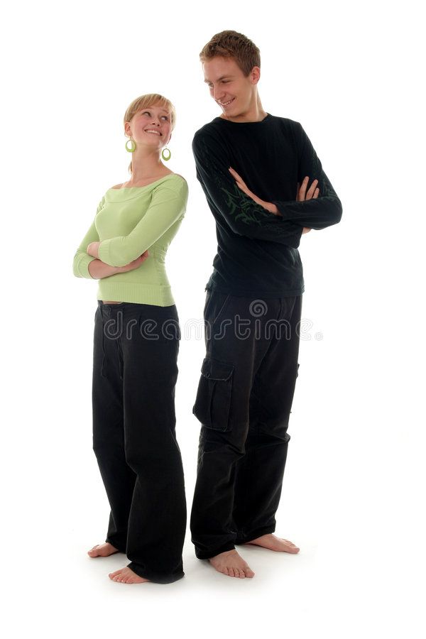 two people standing next to each other with their arms crossed royalty images and clippings