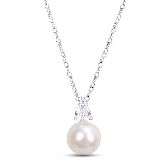 This exceptional necklace displays a lustrous freshwater cultured pearl topped by a sparkling pear-shaped white lab-created sapphire. Styled in sterling silver, the pendant sways from an 18-inch cable chain that secures with a spring ring clasp. Elegant Pear Shaped Drop Necklace With Brilliant Cut, Elegant Pear-shaped Drop Necklace With Brilliant Cut, Elegant Pear-shaped Brilliant Cut Drop Necklace, Fine Jewelry Pear-shaped Drop Necklace For Formal Events, Elegant Pear-shaped Drop Necklace In Diamond White, Elegant Pear Shaped Necklace With Diamond Accents, Elegant Pear-shaped Necklace With Diamond Accents, Elegant White Teardrop Solitaire Necklace, Formal Pear-shaped Pearl Necklace