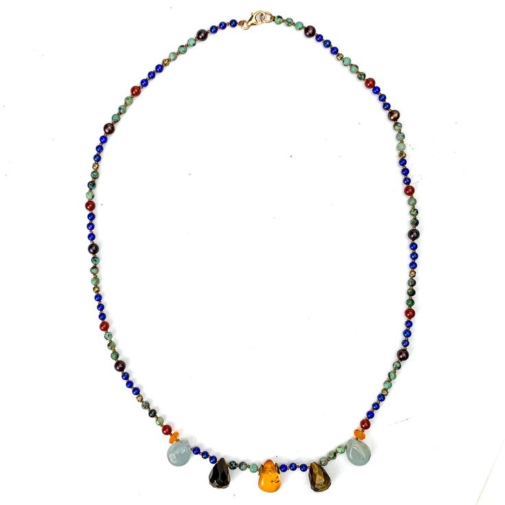 Lapis Lazuli, Turquoise, Amber, Tiger's Eye, Aquamarine, Carnelian, Freshwater Pearl, and Gold Vermeil Hand Knotted One of a Kind Necklace. 19.25" long, hand knotted onto silk cord, with a gold vermeil trigger clasp. Main body is predominately 3mm Turquoise and Lapis Lazuli beads. Blue Multi-stone Spiritual Gemstones, Spiritual Blue Multi-stone Gemstones, Lapis Lazuli Beads, Silk Cord, Tiger's Eye, Tiger Eye, Lapis Lazuli, Gold Vermeil, Aquamarine