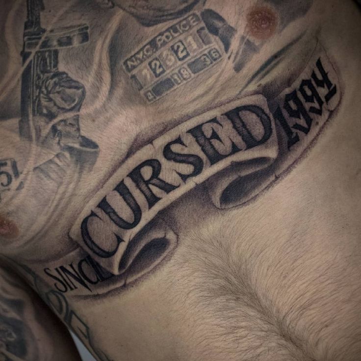 a man's chest with the words cursed on it