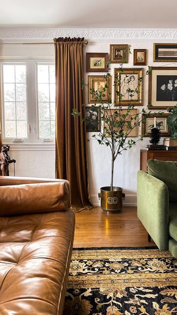 a living room filled with furniture and pictures on the wall