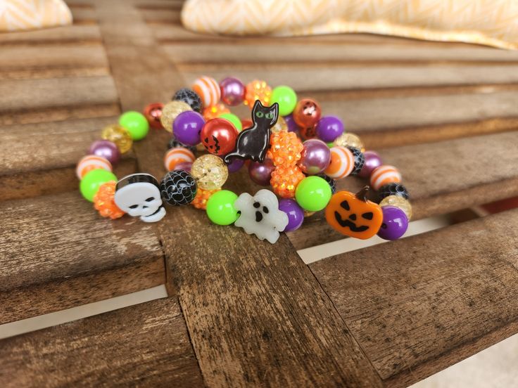 Fun, colorful beaded bracelets for Halloween.  Choose between a black cat, ghost, skull or jack-o-lantern Halloween Multicolor Beaded Bracelets, Halloween Party Beaded Bracelets, Halloween Novelty Bracelet With Round Beads, Adjustable Multicolor Beaded Bracelets For Halloween, Halloween Novelty Multicolor Beaded Bracelets, Multicolor Novelty Bracelets For Halloween, Halloween Novelty Beaded Bracelets With Round Beads, Handmade Multicolor Bracelets For Halloween, Novelty Multicolor Beaded Bracelets For Halloween