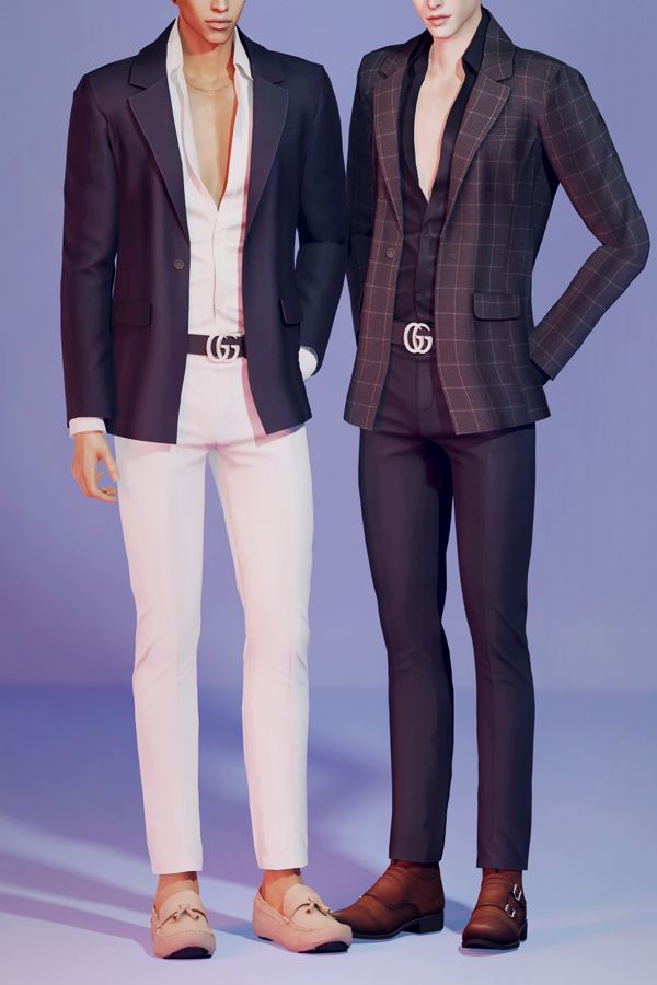 two men standing next to each other wearing suits and shoes with their hands on their hipss