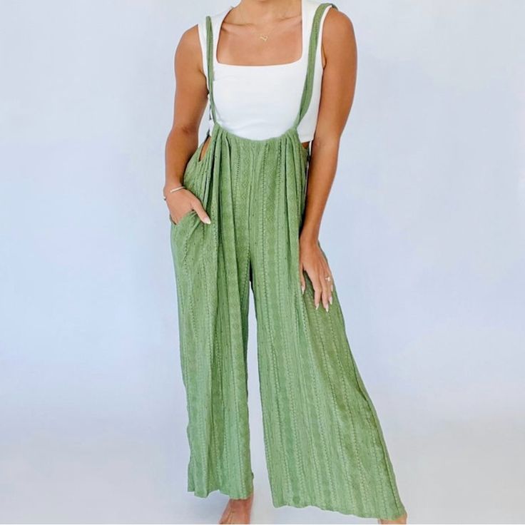 With A High Rise Gathered Design, Side Pockets Fixed Suspenders Straps. Eyelet Lace Flowy Pants Make It Lightweight. Brand Bucket List Size Medium Fabric 95% Polyester 5% Spandex Beach Overalls With Pockets, Spring Vacation Cotton Overalls, Spring Green Jumpsuits And Rompers With Suspenders, High Waist Bottoms With Suspenders For Spring, Chic Spring Bottoms With Suspenders, High Waist Cotton Bottoms With Suspenders, Chic Overall Bottoms For Vacation, Fitted Bottoms With Suspenders For Spring, Spring Beach Jumpsuits And Rompers With Suspenders