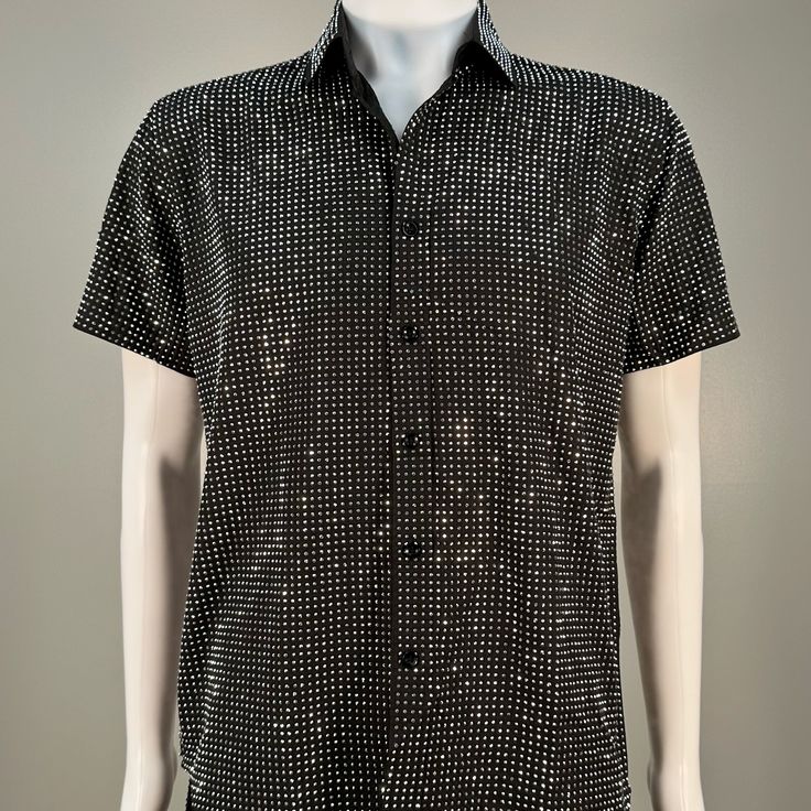 Step into the spotlight with our handmade, sophisticated Silver on Black Short Sleeve Dress Shirt. This true masterpiece embodies elegance and is designed for those who demand attention. Perfectly blending beauty and comfort, it is adorned with a myriad of silver rhinestones that sparkle brilliantly, defying capture by mere photos or videos. Dive into a world where fashion meets functionality, and let this splendid Dress Shirt with short sleeves elevate your style to new heights. Fitted Shirt With Rhinestones For Party, Fitted Party Shirt With Rhinestones, Elegant Party Shirt With Rhinestones, Elegant Black Embellished Shirt, Elegant Embellished Summer Shirt, Formal Fitted Rhinestone Tops, Formal Fitted Tops With Rhinestones, Black Embellished Shirt For Party, Fitted Short Sleeve Party Shirt