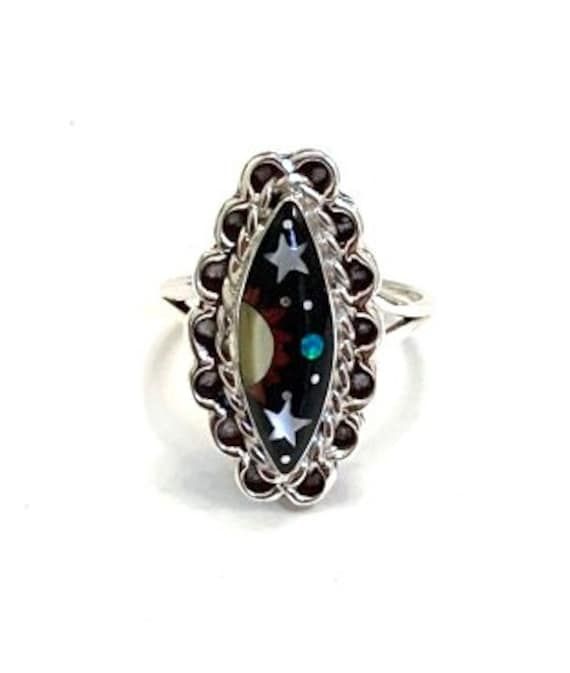 (Guaranteed 100% Sterling Silver) High quality 925 sterling silver size ring with natural genuine multicolor stones. The ring is handcrafted and the stones are inlaid together to create this beautiful Southwestern night themed piece of art jewelry. The stones consist of natural  Black Onyx, Mother of Pearl and Fire opal. The top of the ring measures 7/8'' x 1/2''. Our silver is genuine 925 sterling silver. You will receive the item in a gift box. Thanks for looking and check out more items in my Black Jewelry With Inlay For Gift, Black Inlay Jewelry As A Gift, Multicolor Inlay Rings For Anniversary, Anniversary Multicolor Inlay Rings, Black Sterling Silver Jewelry With Inlay, Black Ring With Inlay, Unique Black Crystal Ring In Sterling Silver, Black Rings With Inlay, Unique Multicolor Rings With Polished Finish