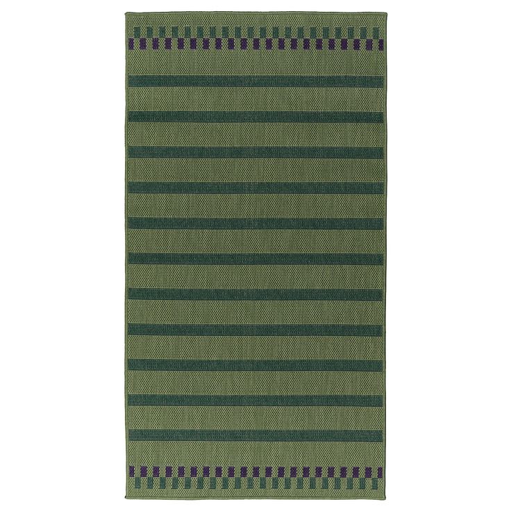 a green and black striped rug on a white background with an area rug in the middle