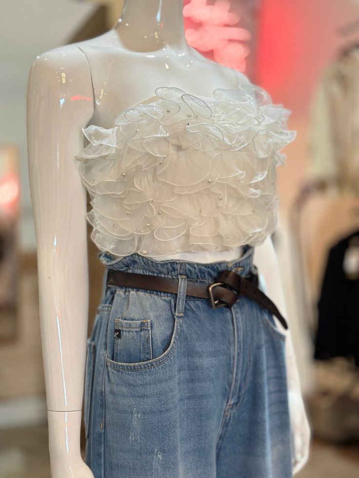 Posh Society's New Women's Organza Fluttery Ruffle Tube Top Make a romantic statement this holiday, with this white organza fluttery ruffle top. This statement top is the perfect layer for your festive outfit and looks dreamy with an airy tulle skirt. Unleash your inner festive diva and make a romantic statement! 100% Polyester; Organza Statement Ruffle Front Smocked Back Solid Print Pull-On In Stock Ruffle Tube Top Outfit, Organza Ruffle Top, Tube Top Outfits, Ruffle Tube Top, White Crop, White Crop Top, Ruffle Top, Large White, Festival Outfits