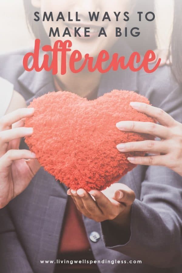 a woman holding a red heart with the words small ways to make a big difference