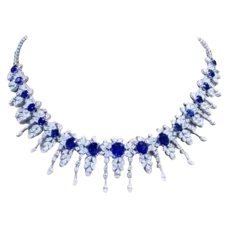 A very piece of art for this necklace in contemporary and romantic style , by Italian designer. So glamour and unique! Necklace is in 18k gold and come with 17 pieces of exceptional royal blue Ceylon sapphires, in oval cut, fine quality, of 24,30 carats, each sapphire is about of 3,50 carats, and 231 pieces of natural diamonds, drop and round brilliant cut of 18,78 carats, F color and VS clarity . Handcrafted by artisan goldsmith. Excellent manufacture and quality. Complete with gemological report. Whosale price. Note: on my shipment, customers not pay taxes and duty. Dress Reference, Church Outfit, 18k Gold Necklace, Ceylon Sapphire, Expensive Jewelry, Unique Necklace, Italian Designer, Fantasy Jewelry, Stunning Jewellery