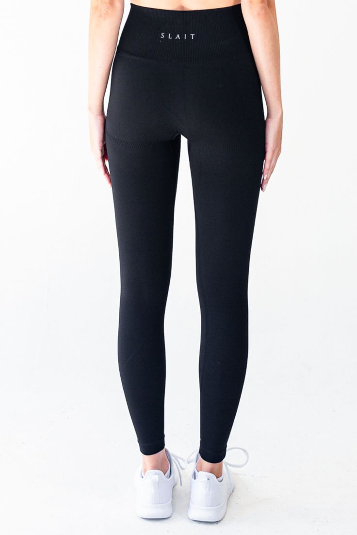 The Nautilus Seamless Legging in Black is designed to enhance your active lifestyle. The high-waist compression waistband provides a secure fit and the subtle contouring accentuates your curves. The full-length design is versatile for any workout or activity. Made with seamless technology, these leggings stretch to hug your body for a comfortable fit and unrestricted movement. The fabric is soft to the touch and quick to dry, making it perfect for everyday wear. Experience the ultimate in comfort and performance with the Nautilus Seamless Legging. Material: 87% Nylon & 13% Spandex GSM: 280G Model is 5'9" and wears a size S Sporty Seamless Elastane Tights, Functional Stretch Seamless Yoga Pants, Functional Compressive Seamless Tights, Seamless Solid Bottoms For Training, Functional Seamless Tights For Pilates, Seamless Tights For Workout, Seamless Training Tights, Functional Compression Tights With Seamless Construction, Functional Full-length Seamless Tights