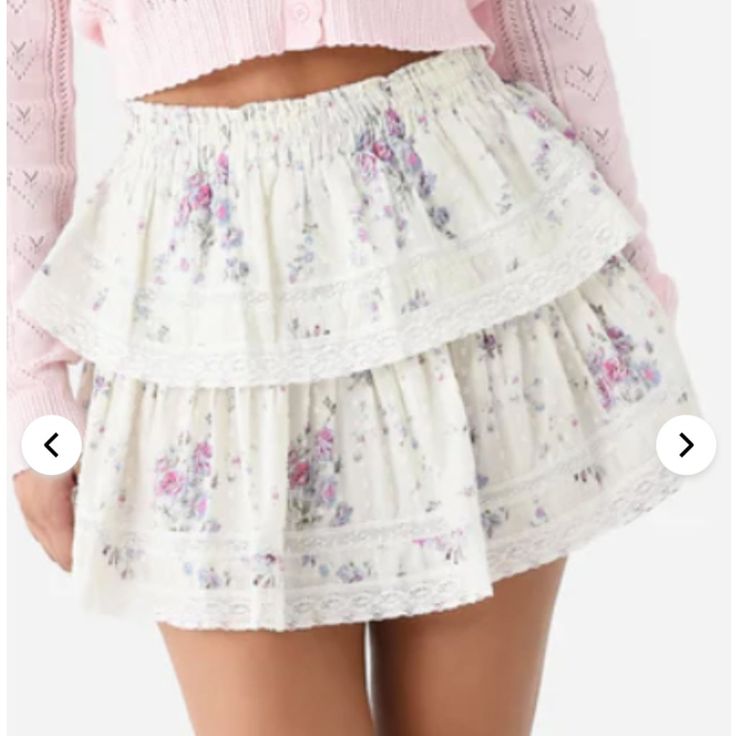 Brand New With Tags, Never Worn Smocked Waistband Tiered Silhouette Inset Lace Details All-Over Novelty Print 100% Cotton Slim Fit Model Is Wearing Size Small Skirt. Model's Measurements: Height: 5'9" | Bust: 32b | Waist: 24" | Hips: 36" | Dress Size: 2 (Us) Feminine White Skirt With Ruffle Hem, White Tiered Bottoms For Spring, Feminine Tiered Skirt For Daywear, White Feminine Skirt With Elastic Waistband, White Ruffle Hem Skirt For Daywear, Feminine Tiered Skirt With Lace Trim, White Tiered Bottoms With Lace Trim, Feminine Bottoms With Lace Trim And Tiered Skirt, Feminine Tiered Skirt Bottoms With Lace Trim