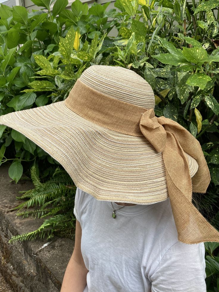 "Floppy straw beach hat with natural linen ribbon and bow. Summer straw hat is perfect for wearing to the beach, a picnic, out and about in town on a warm, sunny day! Natural linen bow Grosgrain ribbon interior headband Brim size - 5 1/4\" Full diameter - 18\" Head size - 21\" Wire in brim edge for shaping Sun n' Sand Headwear Condition is very good." Curved Brim Panama Hat For Beach Season Picnic, Beach Season Panama Hat For Picnic With Curved Brim, Lightweight Cream Straw Hat For Beach, Cream Woven Sun Hat For Vacation, Beige Straw Sun Hat For Picnic, Lightweight Cream Straw Hat For The Beach, Cream Straw Sun Hat For Vacation, Summer Straw Sun Hat For Garden Party, Straw Summer Sun Hat For Garden Party