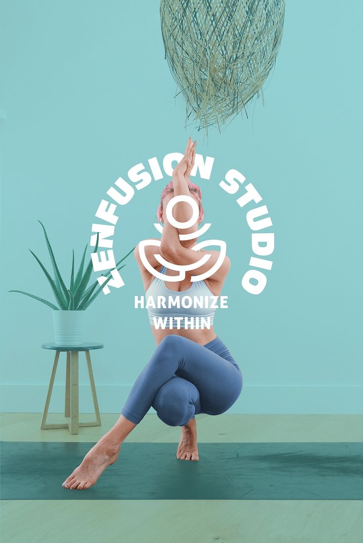 a woman doing yoga in front of a blue wall with the words hemusion studio on it