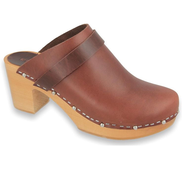 Are you looking for quality high heel clogs? CHOCCO Klogga - stylish and elegant Swedish clogs from quality fullgrain leather on wooden high heel soles CHOCCO clogs are made from quality fullgrain leather. This clog is a perfect blend of comfort and style. It offers optimal support and a timeless look. CHOCCO clogs are also lightweight due to their poplar wood soles. The brown colour is always in fashion. CHOCCO clogs are in classic style so you can wear them with any outfit. They are suitable f Brown High Heel Mules With Deep Heel Cup, Wooden Closed Toe Clogs With Stacked Heel, Brown Closed Toe Mules With Deep Heel Cup, Wooden Clogs With Stacked Heel And Round Toe, Wooden Clogs With Stacked Heel And Closed Toe, Classic Brown Heels With Heel Loop, Brown High Heel Clogs With Deep Heel Cup, Leather Clogs With Wooden Block Heel, Leather Clogs With Deep Heel Cup And Block Heel