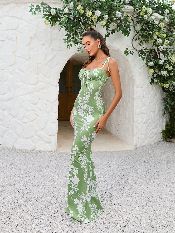 This Blooming Beauty maxi dress features a stunning floral print, tie shoulder details, and a flattering mermaid hem. Perfect for any special occasion, this dress will make you feel elegant and beautiful. Embrace effortless style with this must-have addition to your wardrobe. Color : Green Style : Elegant Details : Knot, Zipper, Ruched Bust Pattern Type : Floral, Random Print Type : Cami Sleeve Length : Sleeveless Neckline : Spaghetti Strap Waist Line : High Waist Hem Shaped : Mermaid Length : Maxi Fit Type : Slim Fit Fabric : High Stretch Material : Knitted Fabric Composition : 95% Polyester, 5% Elastane Care Instructions : Hand wash or professional dry clean Sheer : No Size US Length Bust Waist Size Hip Size XS 2 138.5 72 58 84 S 4 140 76 62 88 M 6 141.5 80 66 92 L 8/10 143 86 72 98 XL 1 Fitted Maxi Dress With Spaghetti Straps For Garden Party, Floral Print Spaghetti Strap Maxi Dress For Prom, Party Floral Print Maxi Dress With Square Neck, Square Neck Floral Print Maxi Dress For Party, Party Maxi Dress With Floral Print And Square Neck, Spring Mermaid Hem Dress With Fitted Bodice, Spring Prom Maxi Dress With Square Neck, Summer Mermaid Hem Maxi Dress For Prom, Elegant Spring Mermaid Maxi Dress